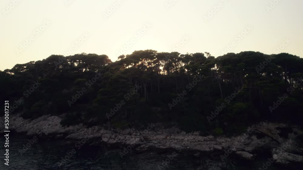 Drone Over Trees On Island Towards Sunset Off The Coast Of Dubrovnik Drone Over Trees On Island Towards Sunset Off The Coast Of Dubrovnik