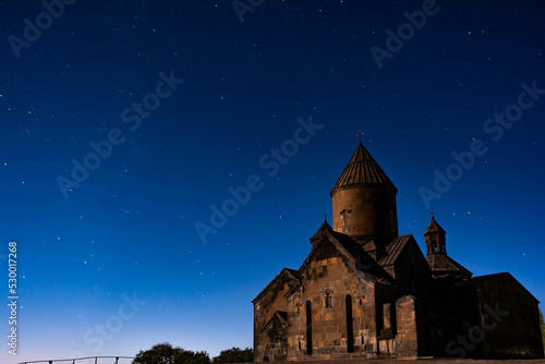 Night landscape  church on the background of the night sky. The shining stars and the old monastery