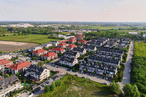 Fototapeta Naklejka Na Ścianę i Meble -  Aerial view of suburban neighborhood, Residential district with houses and streets in small european town