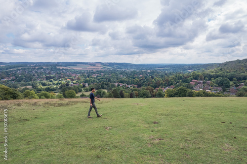 Man walking in the field, Amazing view of Goring and Streatley, village town near Reading, England photo