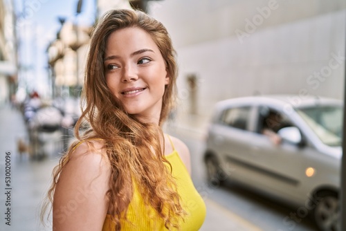 Young caucasian girl smiling confident at street