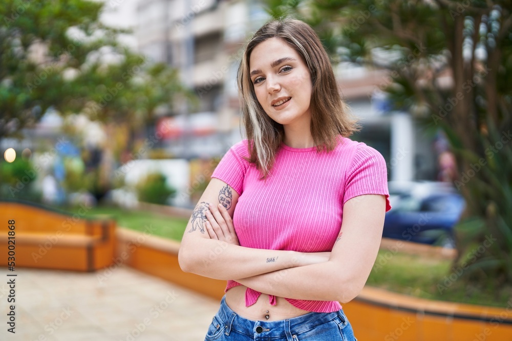 Young woman smiling confident standing with arms crossed gesture at park Young woman smiling confident standing with arms crossed gesture at park