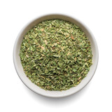 Dried oregano seasoning in round bowl isolated on white. Top view.