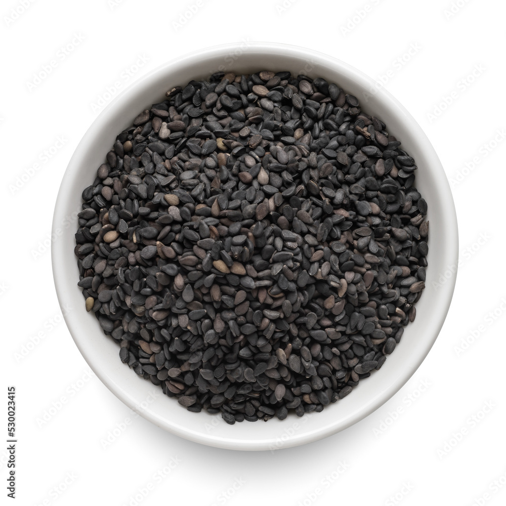Black sesame seeds in round bowl isolated on white. Top view. Black sesame seeds in round bowl isolated on white. Top view.