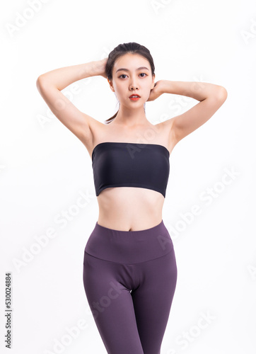 Beautiful women stretch in fashionable sportswear © 大 李