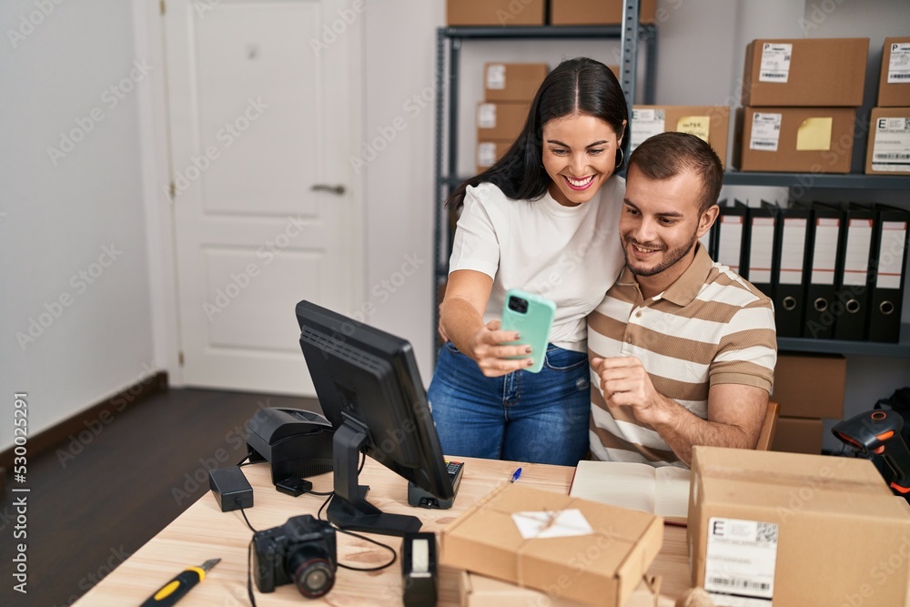Man and woman business workers make selfie by the smartphone working at storehouse Man and woman business workers make selfie by the smartphone working at storehouse