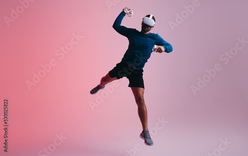 Energetic gamer throwing a ball in virtual reality © Jacob Lund