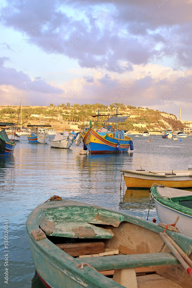 traditional colorful fishing boats at Marsaxlokk village Malta