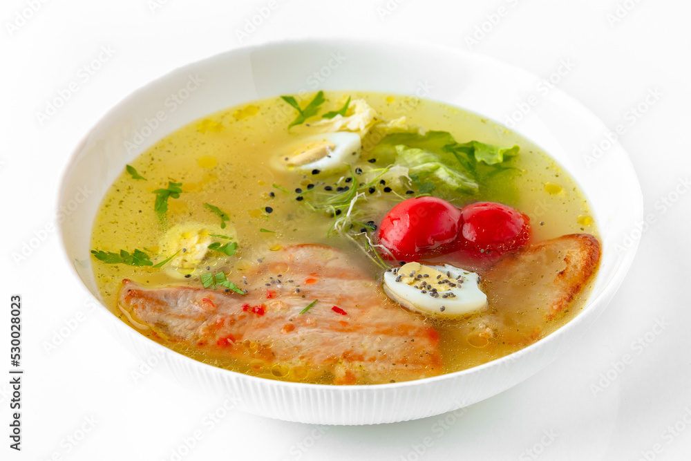 Fragrant first coursefrom chicken broth, quail eggs and poultry meat. Dietary cream soup based on baked and fresh vegetables with herbs. Fitness menu. Delivery of prepared food. White backgr Fragrant first coursefrom chicken broth, quail eggs and poultry meat. Dietary cream soup based on baked and fresh vegetables with herbs. Fitness menu. Delivery of prepared food. White backgr