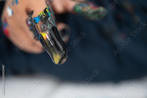 Close up of a child's hand covered in paint, hand painting
