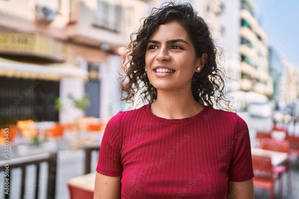 Young latin woman smiling confident standing at street Young latin woman smiling confident standing at street