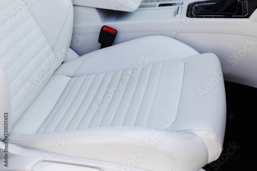 Details of white leather seat in a luxury car. © kucheruk