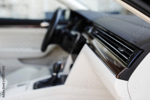 Air vent grill in modern car interior.