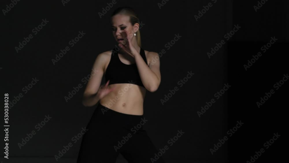 Energetic Young Woman Choreographer Dancing in Studio Energetic Young Woman Choreographer Dancing in Studio