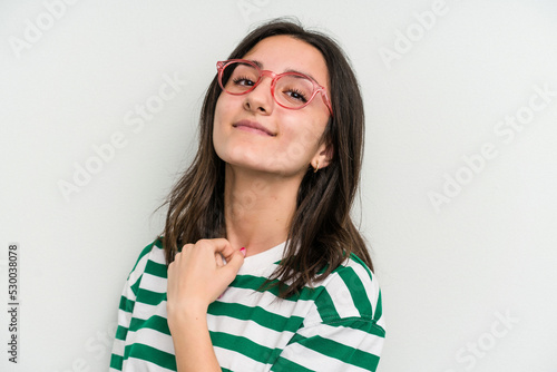 Young caucasian woman wearing a glasses isolated on blue background © Asier