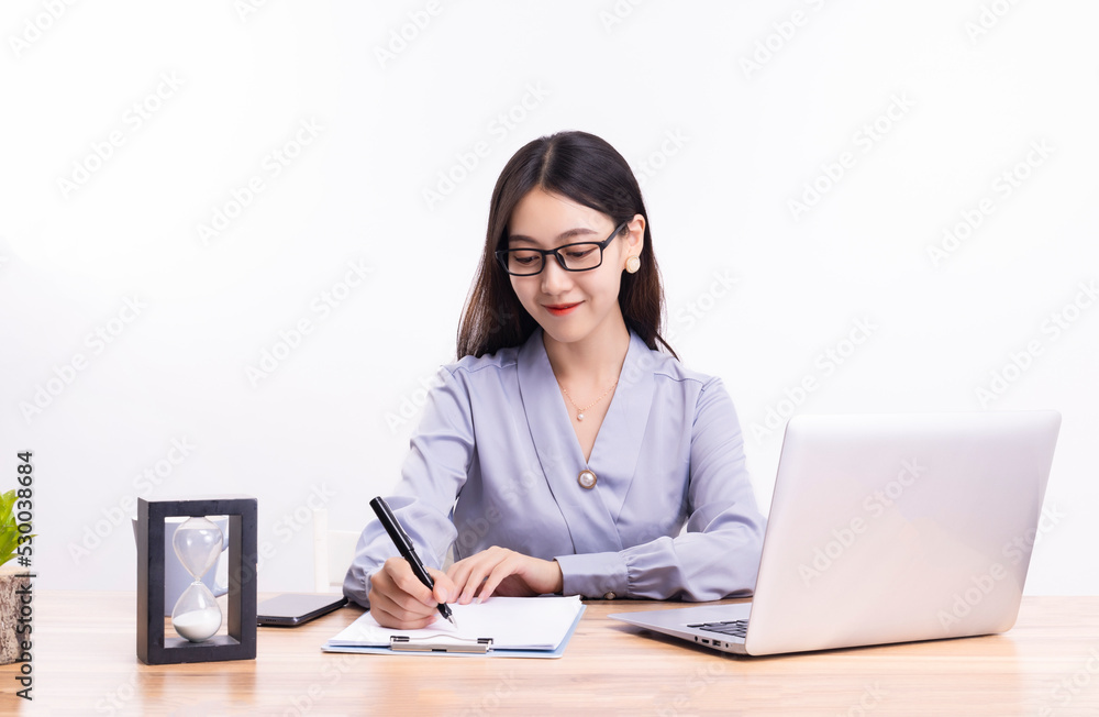 Business women who sit at their desks Business women who sit at their desks