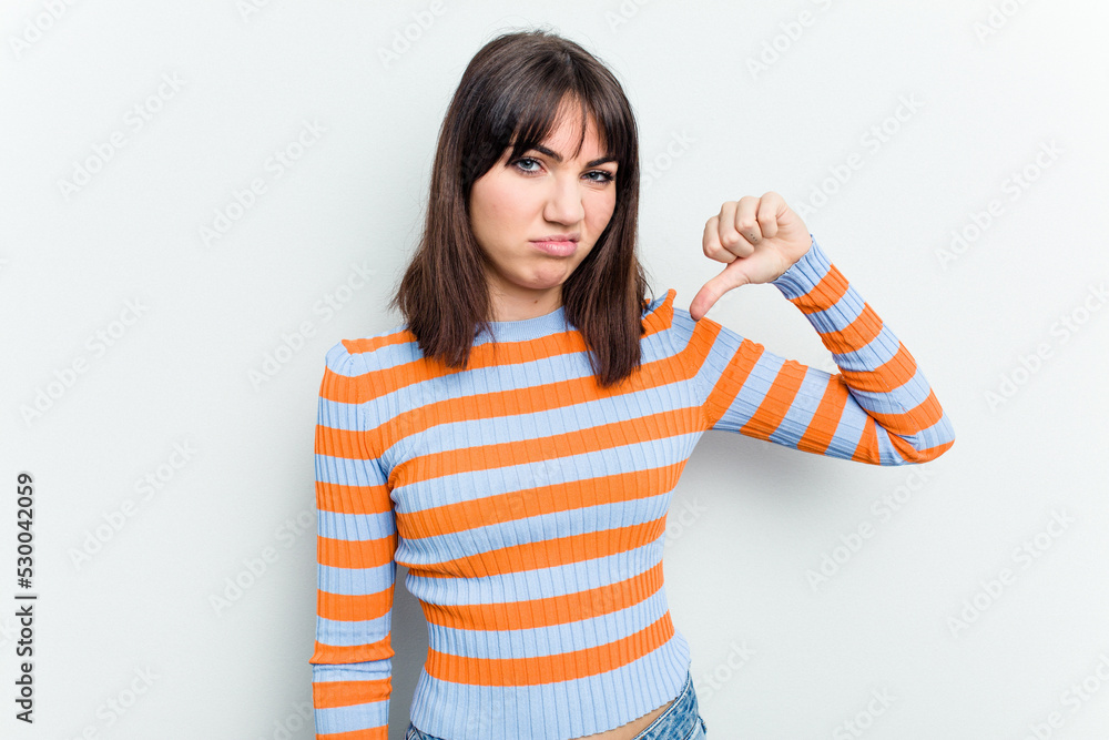Young caucasian woman isolated on white background showing thumb down, disappointment concept.