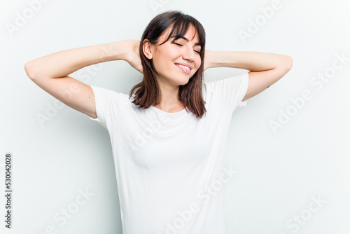Wallpaper Mural Young caucasian woman isolated on white background stretching arms, relaxed position. Torontodigital.ca