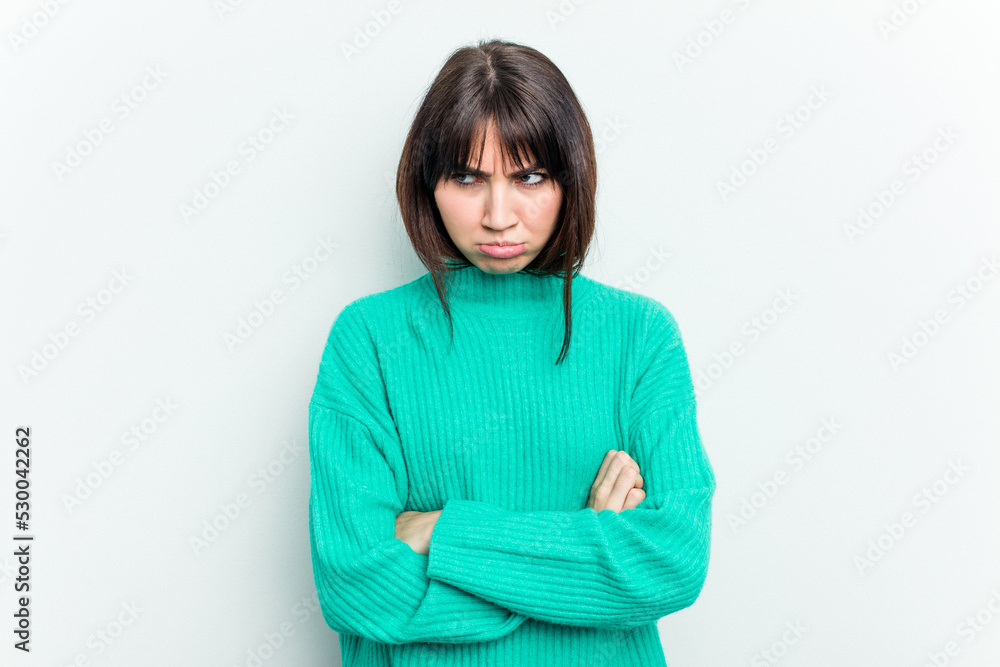 Young caucasian woman isolated on white background tired of a repetitive task. Young caucasian woman isolated on white background tired of a repetitive task.