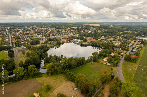 Sweden, Knislinge – September 10, 2022: Aerial view of a little village, golf course, green field. Prive houses. 