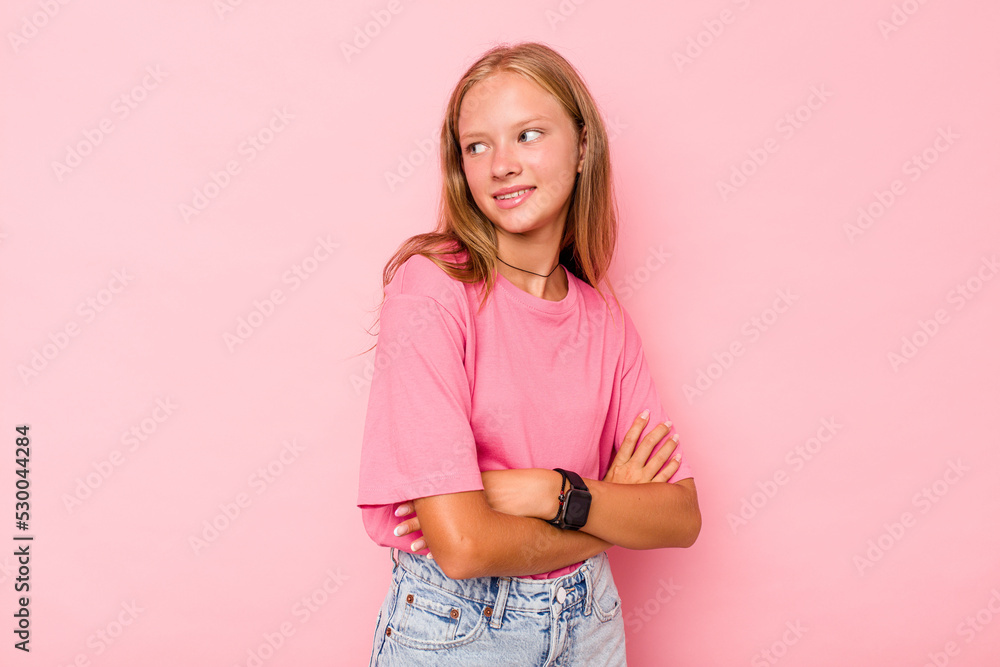 Caucasian teen girl isolated on pink background laughing and having fun. Caucasian teen girl isolated on pink background laughing and having fun.
