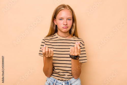 Caucasian teen girl isolated on beige background showing that she has no money.