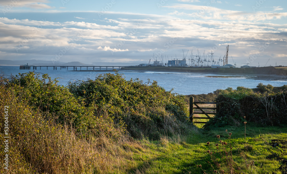 Early morning on the coast path at Lilstock on the Bristol Channel, Somerset looking towards Hinkley Point