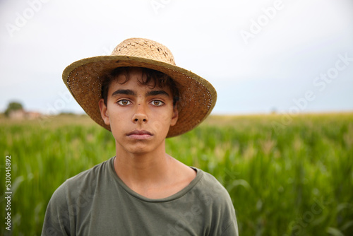 Portrait of a farmer in a straw hat