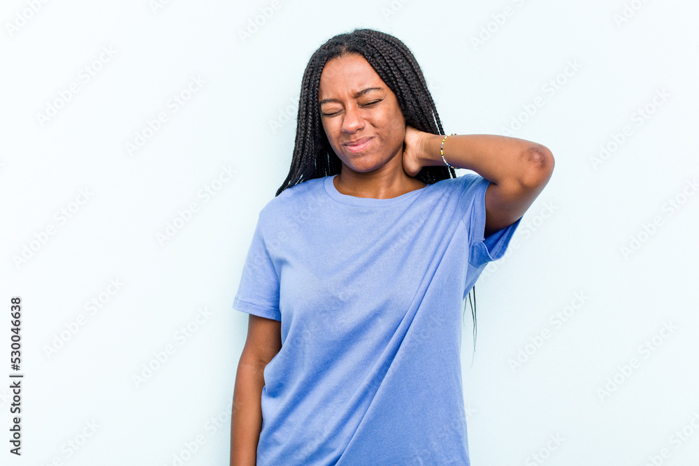 Fototapeta premium Young African American woman with braids hair isolated on blue background suffering neck pain due to sedentary lifestyle.