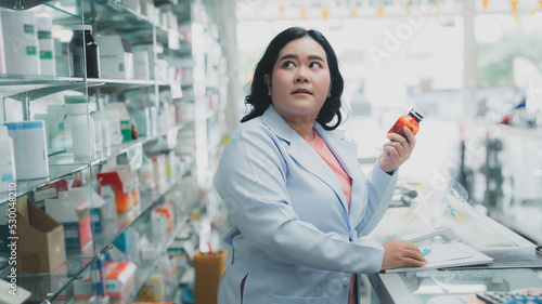 female pharmacist assistant Female doctor check prescriptions at drugstore.expertise Pharmacy business.Professional seller medicamen.