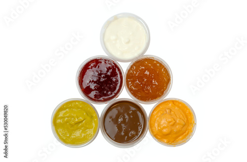 Set of different sauces isolated on white background, top view