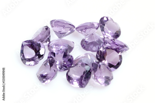 Natural gemstone purple amethyst on white background
