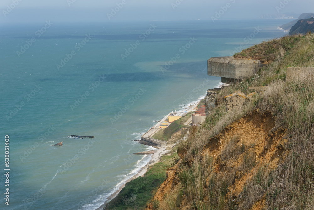 Fototapeta premium Wreck of a World War 2 cargo ship of the Liberty class Lee S. Overman with view the Alabaster Coast and a bunker Octeville-sur-Mer, Normandy, France