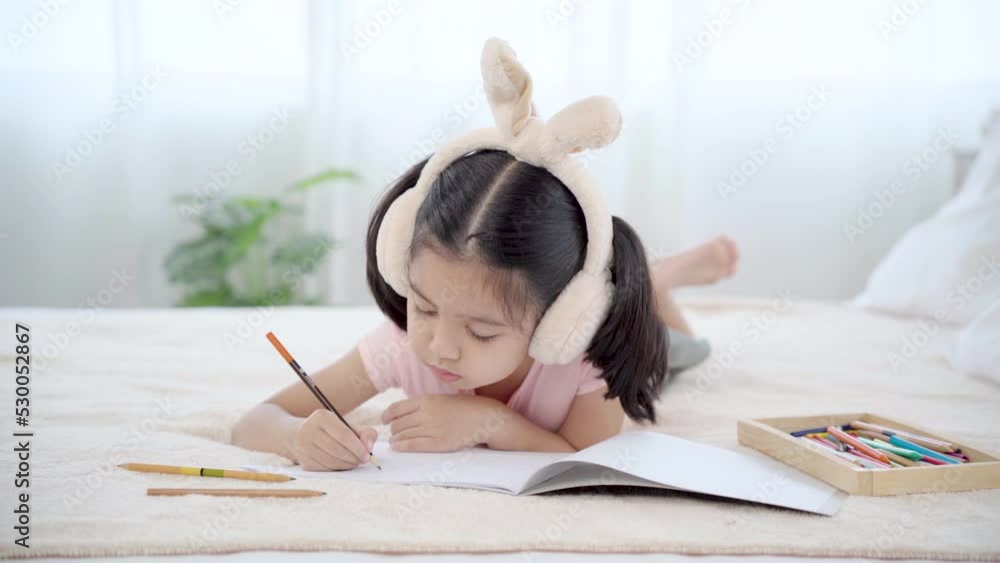 Cute primary school age girls drawing coloring picture with pencils on bed in holiday. Adorable child enjoying creative art hobby activity at home, children development at home concept.
Cute primary school age girls drawing coloring picture with pencils on bed in holiday. Adorable child enjoying creative art hobby activity at home, children development at home concept.