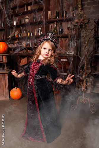 the princess of all witches in a charming Halloween costume