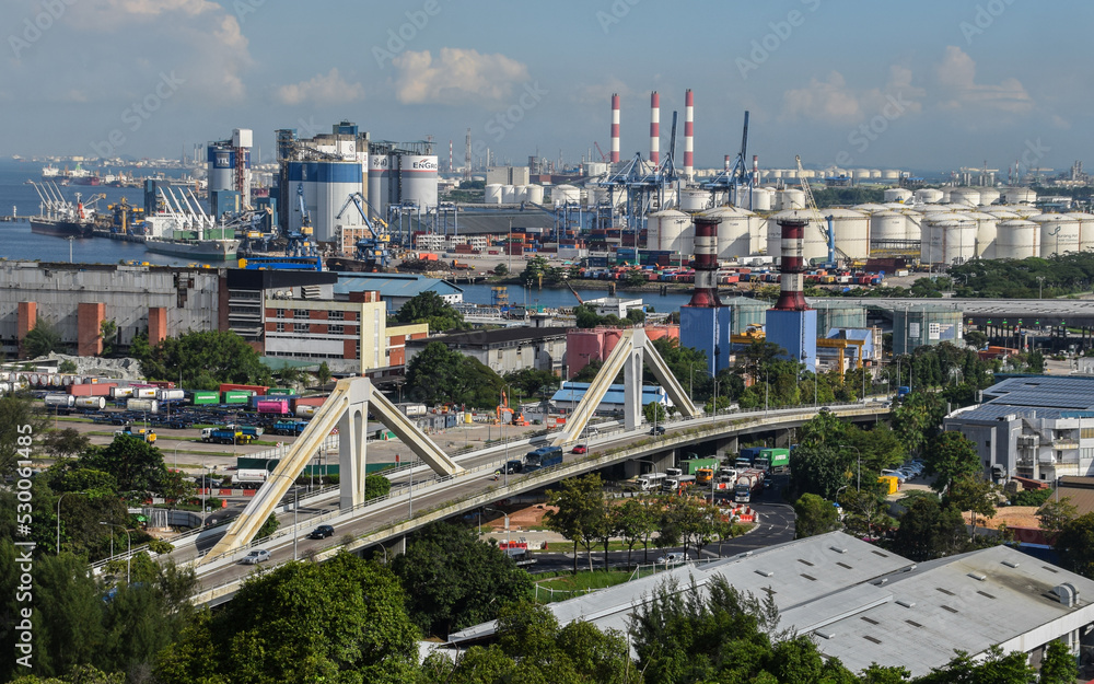 Obraz premium A bird's eyeview of Jurong Industrial Estate in the western part of Singapore. In the background are Jurong Port and Jurong island which is home to many petrochemical plants.