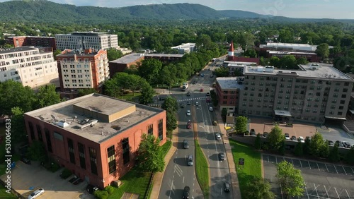 Downtown Charlottesville Virginia aerial of office buildings and traffic. Mountains in distance. photo