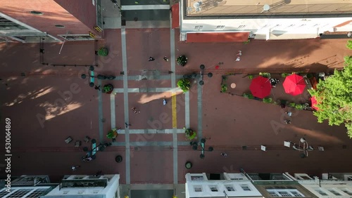 Downtown Mall, pedestrian walk on brick street with shops restaurants and tourist attractions. Charlottesville Virginia. Aerial in summer evening. photo