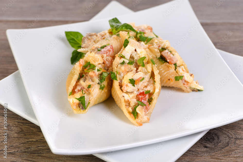 Pasta Conchiglioni stuffed with tender chicken pieces, mushrooms and vegetables in a rich creamy sauce. Pasta Conchiglioni stuffed with tender chicken pieces, mushrooms and vegetables in a rich creamy sauce.