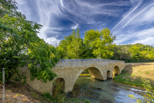 Romanesque bridge of Artigue and river Osse near Larressingle on route to Santiago de Compostela, UNESCO World Heritage Site, departement Gers, France