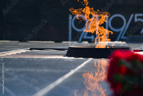 Monument to the fallen soldiers - liberators in the Second World War. A memorial with an eternal flame. photo