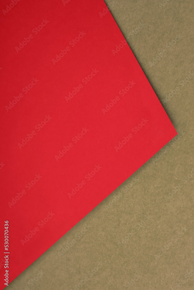 Plain red paper sheet lying on yellow brown textured Background like an open book from top angle Plain red paper sheet lying on yellow brown textured Background like an open book from top angle