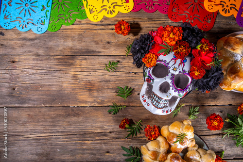 Spanish Mexican traditional holiday, autumn festival Day of the Dead (dia de los muertos) background. With traditional Pan de Muerto bread, decorations and marigold and cempasuchil  flowers photo