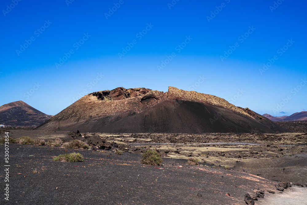 Close photo of the Volcan del Cuervo and the sea of lava solidified around it. Photography made in Lanzarote, Canary Islands, Spain.