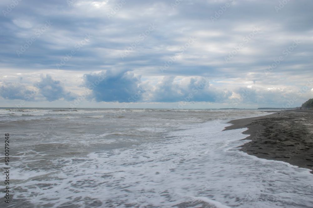 waves breaking on the beach