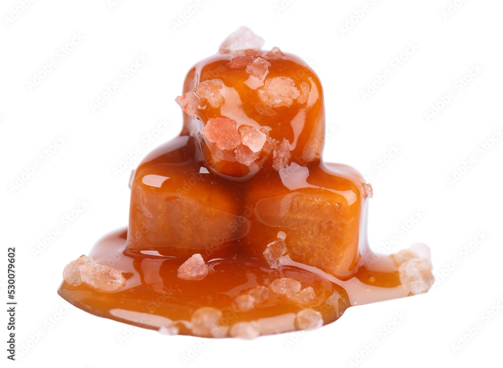 Sweet caramel candies and sauce, isolated on white background. Delicious salty caramel. Sweet caramel candies and sauce, isolated on white background. Delicious salty caramel.