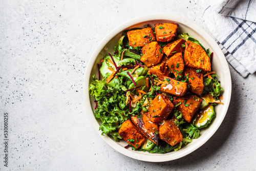 Фотография Baked sweet potato salad bowl with mustard dressing