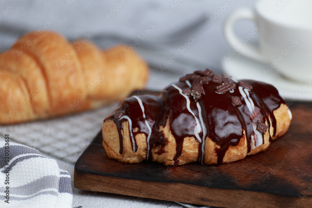 Freshly baked croissants on dark background with copy space Freshly baked croissants on dark background with copy space
