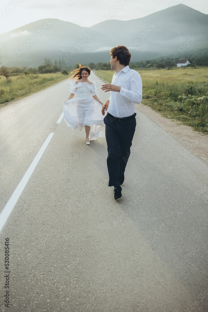 Young smiling wedding couple. Happy bride and stylish groom. Wedding. High quality photo Young smiling wedding couple. Happy bride and stylish groom. Wedding. High quality photo