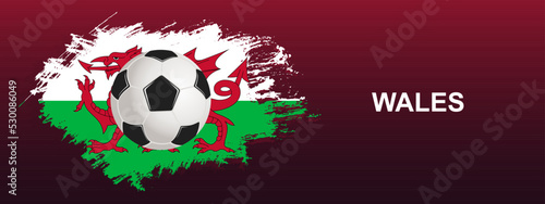 Wales Flag with Ball. Soccer ball on the background of the flag of Wales. Vector illustration for banner and poster.